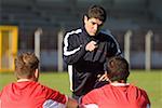 Soccer coach pointing at a player