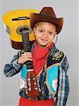 Portrait of Boy Holding Guitar