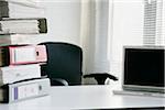 Paperwork and Laptop Computer on Office Desk