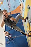 People in Climbing Gym, Man Talking on Cellular Phone