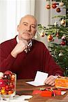Man Writing in Christmas Card