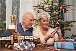 Couple Wrapping Christmas Gifts