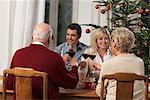 Family Toasting at Dinner Table