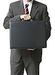 Mid section view of a businessman holding a briefcase