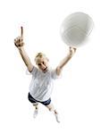 Portrait of a young woman holding up a volleyball