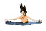 Portrait of a teenage girl doing the splits in mid-air