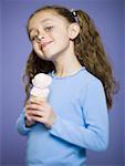 Close-up of a girl holding an ice cream cone