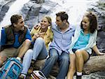 Close-up of two young women and two young men talking to each other