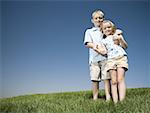 Boy and girl playing on a hill