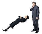 Businesswoman levitating with businessman yawning