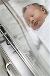 High angle view of a baby boy lying in a hospital nursery