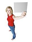 High angle view of a woman holding up a blank sign