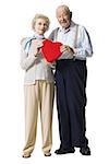 Older man giving wife Valentines chocolate