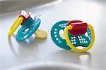 Close-up of two baby pacifiers