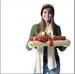 Girl with Christmas gifts smiling