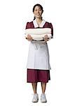 Portrait of a waitress holding towels