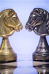 Close-up of chess pieces facing each other