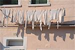 Low angle view of a clothesline outside a building