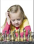 Close-up of a girl playing chess