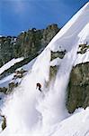 Downhill skier skiing on mountain