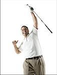 Low angle view of a mid adult man holding a golf club