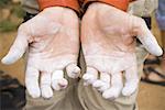 Detailed view of climbing chalk on male hands outdoors