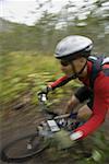 Profile of a mature man mountain biking