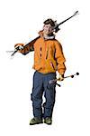 Portrait of a young man holding skis and ski poles