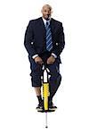 Businessman on a pogo stick