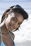 Portrait of a young woman smiling on the beach