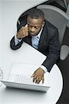 High angle view of a businessman using a laptop