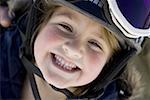 Young girl with ski goggles smiling