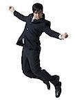 Profile of a businessman jumping in mid air with his arms outstretched