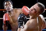 Close-up of boxers fighting in a boxing ring