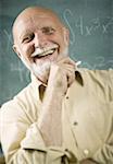 Portrait of a senior male professor laughing