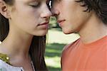 Close-up of a teenage couple kissing each other