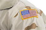 Close-up of a patch of an American flag on soldier's uniform