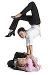 Two female contortionist businesswomen