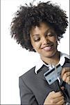 Close-up of a businesswoman cutting a credit card with a pair of scissors