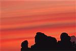 Silhouette of rock formations at dusk