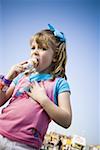 Young girl eating ice cream cone