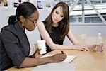 Close-up of two businesswomen in a meeting