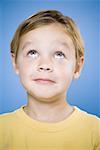 Portrait of a young boy looking up