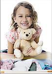 Portrait of a girl holding a teddy bear