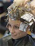 Close-up of a woman getting her hair colored