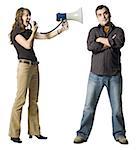 Woman yelling at man through megaphone