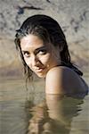 Portrait of a young woman in a lake