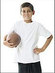 Portrait of a boy holding a football