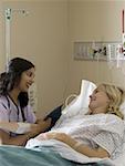 Profile of a female doctor examining the blood pressure of a female patient