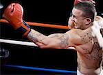 Profile of a young man boxing